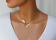 "OMG this is the cutest toggle front choker necklace ever! This lovely chain choker is made of 18k gold filled oval medium size long and short links measure 8x4mm. Toggle sits in front. The \"I Love U\" plaque, lock pendant and heart charm are all heavily 18k gold plated with crystals and pink enamel that make it stand out! I personally love this necklace! Model is wearing a 15\" length. This necklace comes in many lengths please choose your desired length. Best to measure your neck if you not s Catholic Jewelry Necklace, Gold Heart Choker, St Michael Necklace, Lock Charm Necklace, 14kt Gold Jewelry, Pink Charm, Gold Chain Choker, Evil Eye Necklace Gold, Heart Choker