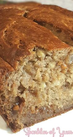 a loaf of banana bread sitting on top of a white plate