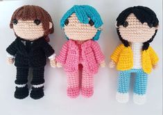 three crocheted dolls sitting next to each other