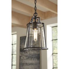 This hanging lantern is expertly crafted with that casual, coastal style you love. A clear glass shade shields a simple light base for a seaside-living vibe. The shade is cradled inside an open-cage black frame featuring thin bars and constructed with a composite polymer, corrosion-resistant housing. DURASHIELD by Progress Lighting is built to last. Constructed from a composite material with UV protection, DURASHIELD holds up even in the harshest weather conditions. This high-performance finish Hanging Porch Lights, Farmhouse Lights, Vermont Farmhouse, Kitchen Cozy, Benton Harbor, Casual Coastal, Seaside Living, Porch Light, Entryway Lighting