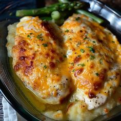 a close up of a plate of food with broccoli and cheese on it