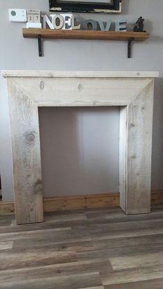 a white fireplace mantle with no love written on it