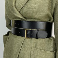 With a modern and elegant design, this leather belt will complete your outfit in style. Easily adjustable through the gold toned buckles, the belt can be worn over a shirt, dress or even a over a coat. Handcrafted in EU using Italian Full Grain Leather and Nickel Plated Hardware        It is recommended to clean the products after each wear as follows:  The leather parts should be wiped with a soft cloth, slightly damp, and let dry at room temperature the metallic elements should be well wiped w Luxury Leather Belt With Brass Hardware, Leather Belts With Gold-tone Rectangular Buckle, Luxury Leather Belts With Gold-tone Hardware, Luxury Leather Belt With Gold-tone Hardware, Luxury Black Belt With Gold-tone Hardware, Wide Leather Belt, Women Motivation, Powerful Women, Leather Belt