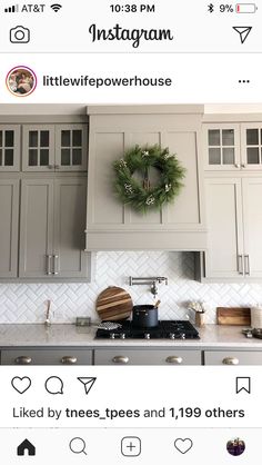 the instagram page on instagram shows an image of a kitchen with grey cabinets and white