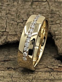 a yellow gold wedding ring with white diamonds on the inside and inlayed to it