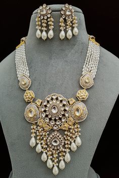 Necklace Diwali Chandbali Pearl Necklace With Intricate Design, White Chandbali Bridal Earrings For Eid, White Bridal Earrings With Stone Work For Celebration, White Round Chandbalis For Celebrations, White Chandbalis For Eid Celebration, Elegant Ceremonial Earrings With Motifs, Festive Jewelry With Intricate Design And Round Beads, White Bridal Earrings For Eid Celebration, Elegant White Chandbalis For Eid