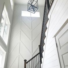 a stair case with a light hanging from it's side