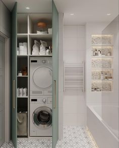 a washer and dryer in a bathroom with white tile flooring on the walls