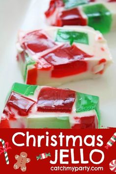 two pieces of candy sitting on top of a white plate with red, green and white squares