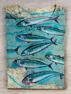 a painting of fish on a wooden surface