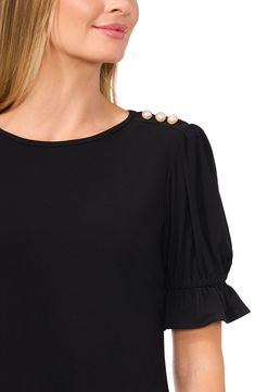 Decorative pearly buttons at the shoulder charm this easy crepe-knit top framed by lightly puffed sleeves with fluttery ruffle cuffs. 23 1/2" length Jewel neck Elbow-length sleeves 95% polyester, 5% spandex Machine wash, line dry Imported Elegant Puff Sleeve Top With Ruffles, Elegant Puff Sleeve Top With Ruffle And Gathered Sleeves, Elegant Puff Sleeve Top With Buttons For Work, Elegant Puff Sleeve Top With Ruffle For Work, Jewel Neck, Elbow Length Sleeve, Puff Sleeve, Knit Top, Nordstrom