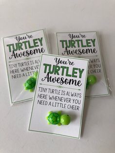 three turtle themed birthday cards with green candies on them, one saying you're turtles awesome and the other saying you need a little cheer