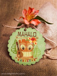 a tag with the name mahlo on it next to a flower and burlock