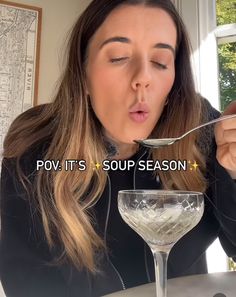 a woman eating food from a spoon with the words pov it's soup season