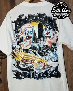 #vintagereprint #tshirt #tee #streetwear #Rollinhard #Mexican #lowriderculture #lowrider #chicano #carculture #lowriderart #chicanoart White Graffiti Print Tops For Halloween, White Band Merch Top With Custom Artwork, Fitted Graphic Print T-shirt For Festival, Pop Culture Shirt With Sublimation Print For Streetwear, Fitted Pop Culture T-shirt For Streetwear, Fitted Graffiti Print T-shirt For Streetwear, Grunge T-shirt For Festival Streetwear, Sublimation Print Tops For Streetwear At Music Festivals, Retro Graphic Print T-shirt For Festivals