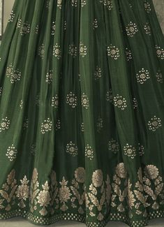 COLOR : Dark Mehendi Green FABRIC : Top - Pure Viscose Silk, Inner - Can Can, Dupatta - Chiffon/Net WORK : Zari, Woven Embroidery, Embroidered Waist Belt, Tassels, Embellished Lace BorderOCCASION : Wedding, Reception, Mehendi, Engagement, Party Wear, Festival READY-TO-WEAR : No STITCHING : Available as semi-stitched fabric, can be stitched using standard size option (+$20). Note: There might be a slight color variation due to lighting and flash used during photoshoot. The bright shade seen is th Silk Anarkali Gown, Green Anarkali Suits, Woven Embroidery, Green Anarkali, Silk Anarkali Suits, Silk Anarkali, Mehendi Outfits, Holiday Promotions, Anarkali Gown