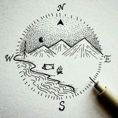 a pen is sitting on top of a piece of paper that has a drawing of mountains in it