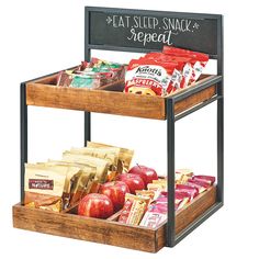 two wooden trays filled with food and snacks