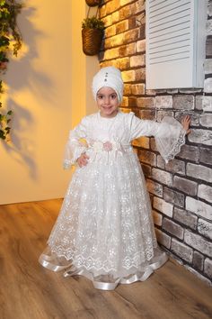 Child Hijab Evening Dress Ayse Model Color: White Fabric Feature: It is made of Sanel Crepe, Multi Chiffon and Tulle fabric. It can be used in 4 seasons. Product Features: It is produced with Şanel crepe, multi chiffon and tulle fabric. It has a hidden zipper on the back. Our product is festoon tulle detailed. The back is belted, if it is wide, it can be tied at the back and adjusted. Note: This product is White in color. If you are looking for a different color, visit our Etys store. https://ww Children Abaya Style With Stone, Floor-length Dress For Ceremony And Eid, White Dress For Eid Ceremony, White Dresses For Eid Ceremony, Dress For Hijab, Dubai Hijab, Girls Kaftan, Muslim Gown, Kids Abaya