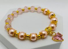 Mother of Pearl Bracelet with Pink Crystal Glass Beads & Pink Crystal Heart Charms - 18k Gold Accents by BeadLetsbyNatalie on Etsy Adjustable Gold Crystal Bracelet For Valentine's Day, Elegant Pink Beaded Bracelets With Heart Beads, Elegant Pink Beaded Heart Bracelet, Elegant Wedding Beaded Bracelets With Heart Beads, Gold Heart-shaped Crystal Bracelet Gift, Gold Crystal Bracelet For Valentine's Day Gift, Elegant Pink Bracelets With Gold Beads, Elegant Pearl Bracelet With Heart Beads For Mother's Day, Gold Crystal Bracelet For Mother's Day