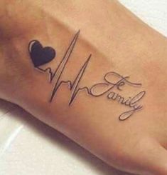 a person with a heart and heartbeat tattoo on their foot