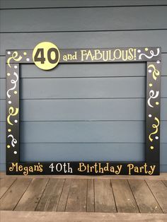 a black and gold birthday party sign with the number forty and fabulous written in it