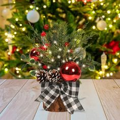 a small christmas tree with ornaments and lights