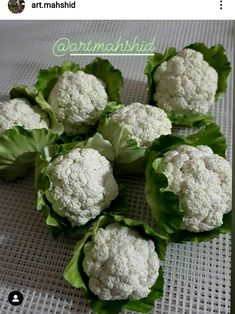 there are many cauliflower heads on the table