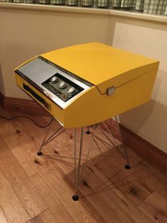 a yellow table with a radio on it