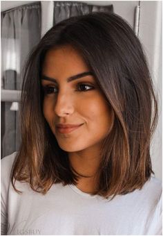 a close up of a person wearing a white t - shirt and looking at the camera