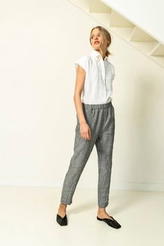 "Tapered linen pants with pockets in side seams. These linen trousers have regular fit and elastic waist. Its cuffs can be rolled up to adjust length. These trendy linen pants can be used in endless outfit combinations. Double washed for extra softness and shrinkage prevention. ABOUT US LINEN ID was born from desire to embrace things that actually matter. We aim to create sustainable garments that offer uncompromised design, are versatile and stay with You as time passes. Every LINEN ID piece is Casual Linen Shirt, Loose Linen Pants, Pants With Elastic Waist, Beach Mini Dress, Tapered Trousers, Comfy Shirts, Womens Pants, Linen Pants Women, Linen Blouse