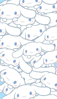 a bunch of little white teddy bears with blue dots on their faces and eyes, all in the same pattern