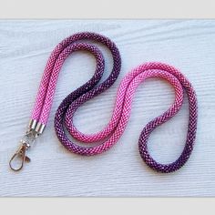 This Lanyard is made from Czech glass seed beads in shiny ombre pink to purple. Very flexible and comfortable to wear. These lanyards not only make your everyday work outfit a little more stylish, but they are also functional accessories to hold your ID badge. They also make a perfect gift! Lanyard length : 38.5 inches (98 cm) Length with holder : 20 inches (50 cm) To browse more of my bead crochet lanyards please follow the link: http://www.etsy.com/shop/lutita?section_id=16455806 Return to the Crochet Lanyard, Nurse Lanyard, Ombre Fashion, Rose Violette, Beaded Lanyards, Functional Accessories, Pink Ombre, Id Badge, Bead Crochet