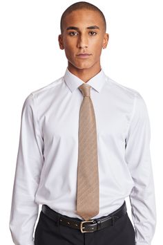 The Stanley Knit Tie in tan adds a pop to any outfit. With a high-quality knit material, you'll have this for years to come. It's the right addition to any brunch or formal party attire, whether you're going casual or fancy.PRODUCT DETAILS: style 6580T slim-tie 100% polyester imported Classic Beige Formal Tops, Elegant Brown Tops For Business Casual, Elegant Brown Top For Business Casual, Classic Brown Formal Tops, Smart Fitted Tops For Formal Occasions, Beige Formal Tops For Fall, Elegant Brown Business Tops, Elegant Brown Business Top, Elegant Beige Business Tops