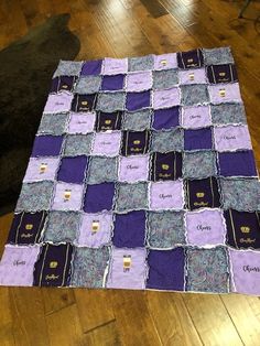 a purple and blue quilt on the floor