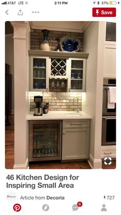 a kitchen with an oven, sink and wine cooler in it's cabinetry