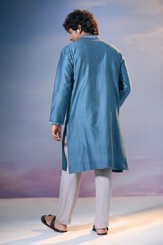 Blue full sleeves kurta with all over quad bloom print and badla embroidery on the yoke. Paired with a satin pant. - Aza Fashions Elegant Blue Kurta With Naqshi Detailing, Blue Naqshi Kurta For Festivals, Blue Long Sleeve Kurta With Naqshi, Ceremonial Blue Kurta With Cutdana, Blue Cotton Silk Long Sleeve Sherwani, Elegant Blue Kurta With Cutdana Details, Badla Embroidery, Blue Semi-stitched Kurta With Cutdana, Blue Mulmul Kurta With Cutdana Detail