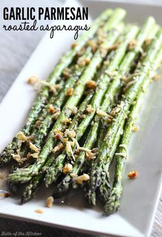 garlic parmesan roasted asparagus on a white plate