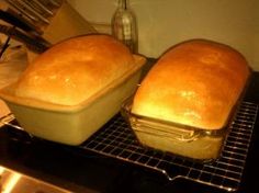 two loafs of bread sitting on top of an oven rack