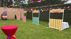 an outdoor party with colorful decorations and tables