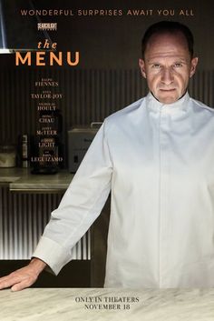 a man standing in front of a menu