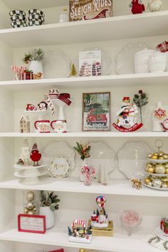 shelves filled with christmas decorations and other items