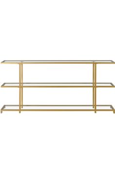 a gold metal and glass shelf against a white background