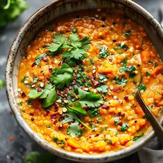 a bowl filled with soup and garnished with cilantro