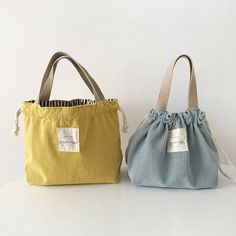 two small purses sitting next to each other