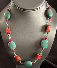 A stunning combination of blue turquoise and vibrant red coral, embellished with intricate Bali beads, adorns a sleek silver chain. This versatile necklace can be adjusted from 16 to 21 inches in length. Coral Accents, Henderson Nv, Red Coral, Blue Turquoise, Stone Bracelet, Vibrant Red, Turquoise Blue, Favorite Jewelry, Silver Chain