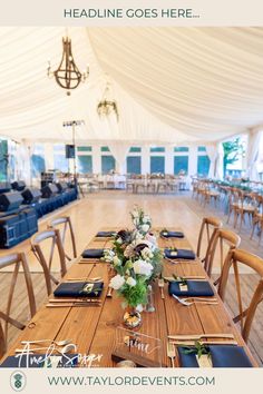 a table set up with place settings and napkins on it in a large tent