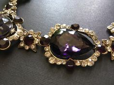 "Featuring clear/pink rhinestones crystals and purple glass stones and linked to cable chain. Just elegant and romantic!! Color: antiqued brass with clear/pink rhinestones crystals and purple glass stones Size: necklace measures around 21\" long x 1.15\" width x 2.5 center drop ** Please note we need to take around 5 days to make it. Please be patient. ** Item ship out with tracking number to you (around 10 to 14 business days for delivery). We also provide fast shipping service, around 3-4 busi Purple Stone Necklace, Amethyst Crystal Necklace, Necklace Amethyst, Necklace Birthstone, Necklace Purple, Necklace Wedding, Amethyst Jewelry, Purple Stones, Jewelry Bridal