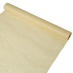 a roll of parchment paper sitting on top of a white surface