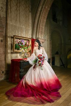 a woman in a white and red wedding dress